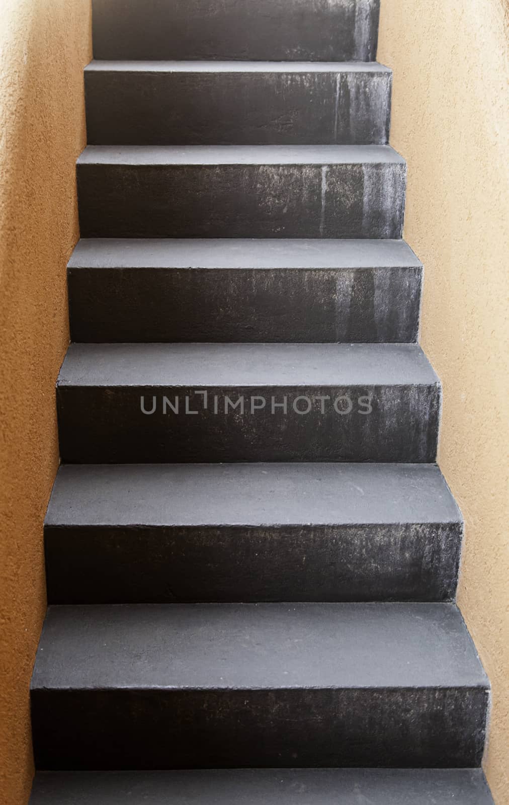 Black stone staircase, detail of a staircase, pedestrians