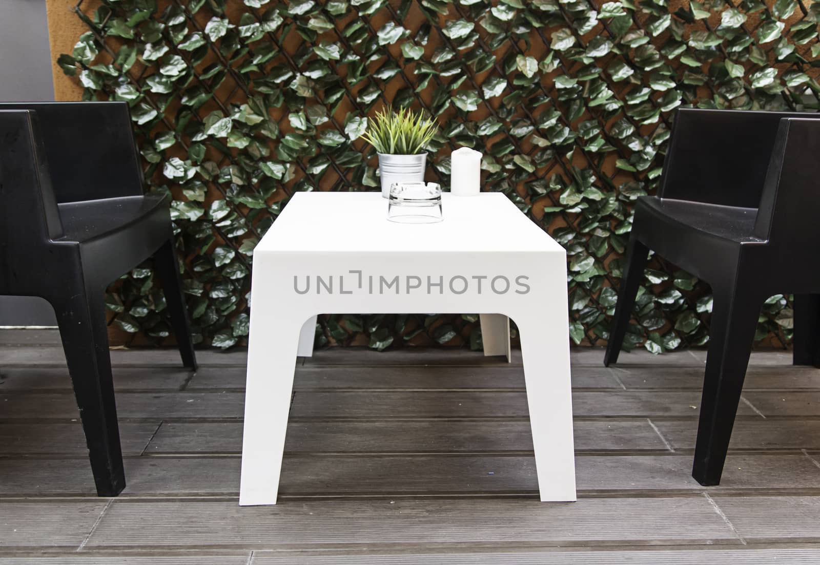 Tables and chairs for breakfast, detail of a sunroom