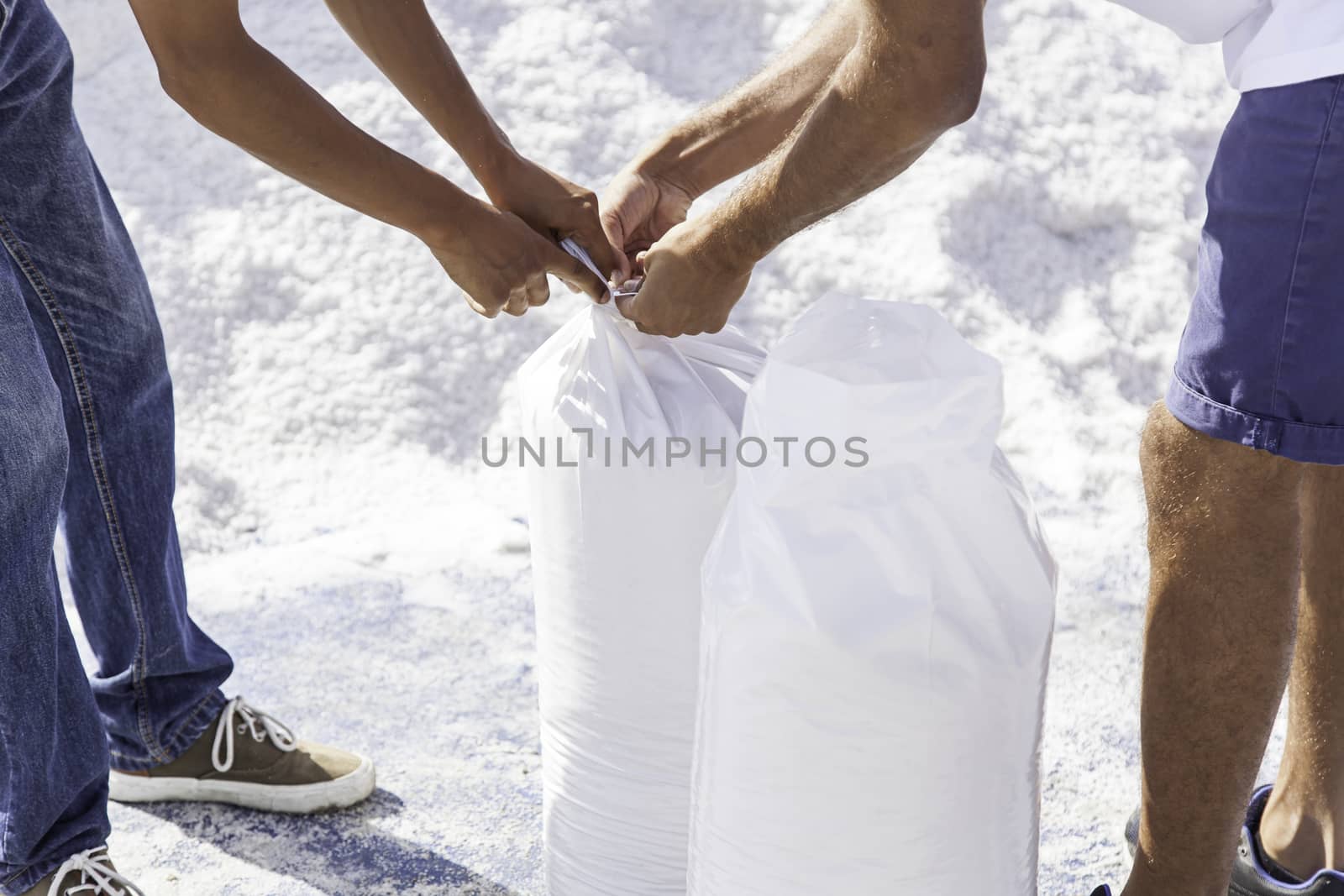 By packing salt workers, detail of people in a natural salt mine