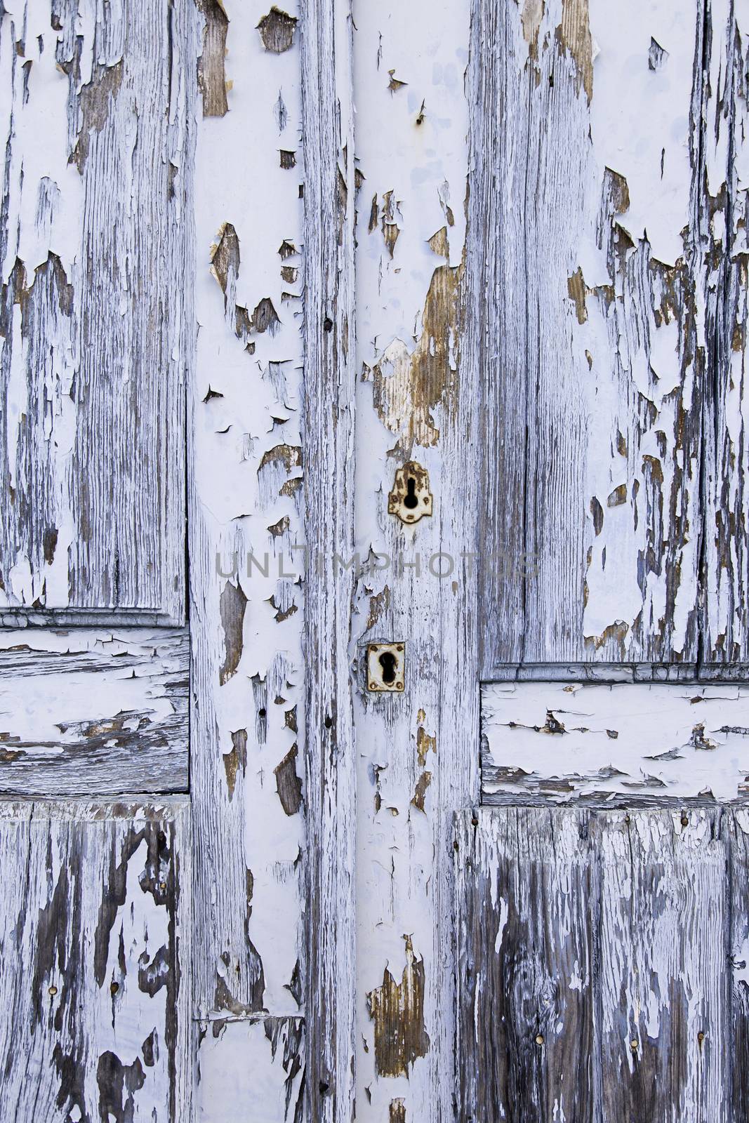 Old decorated door in blue, detail of urban decoration, protection