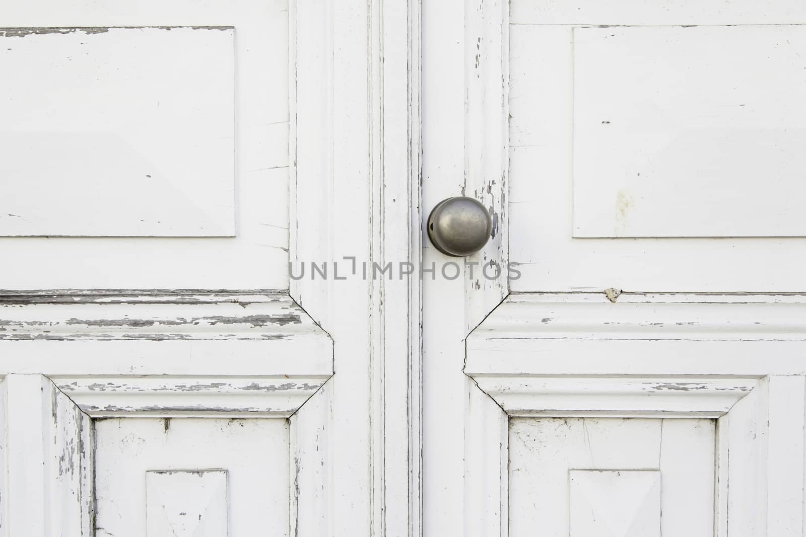 Old white door, detail of a closed door