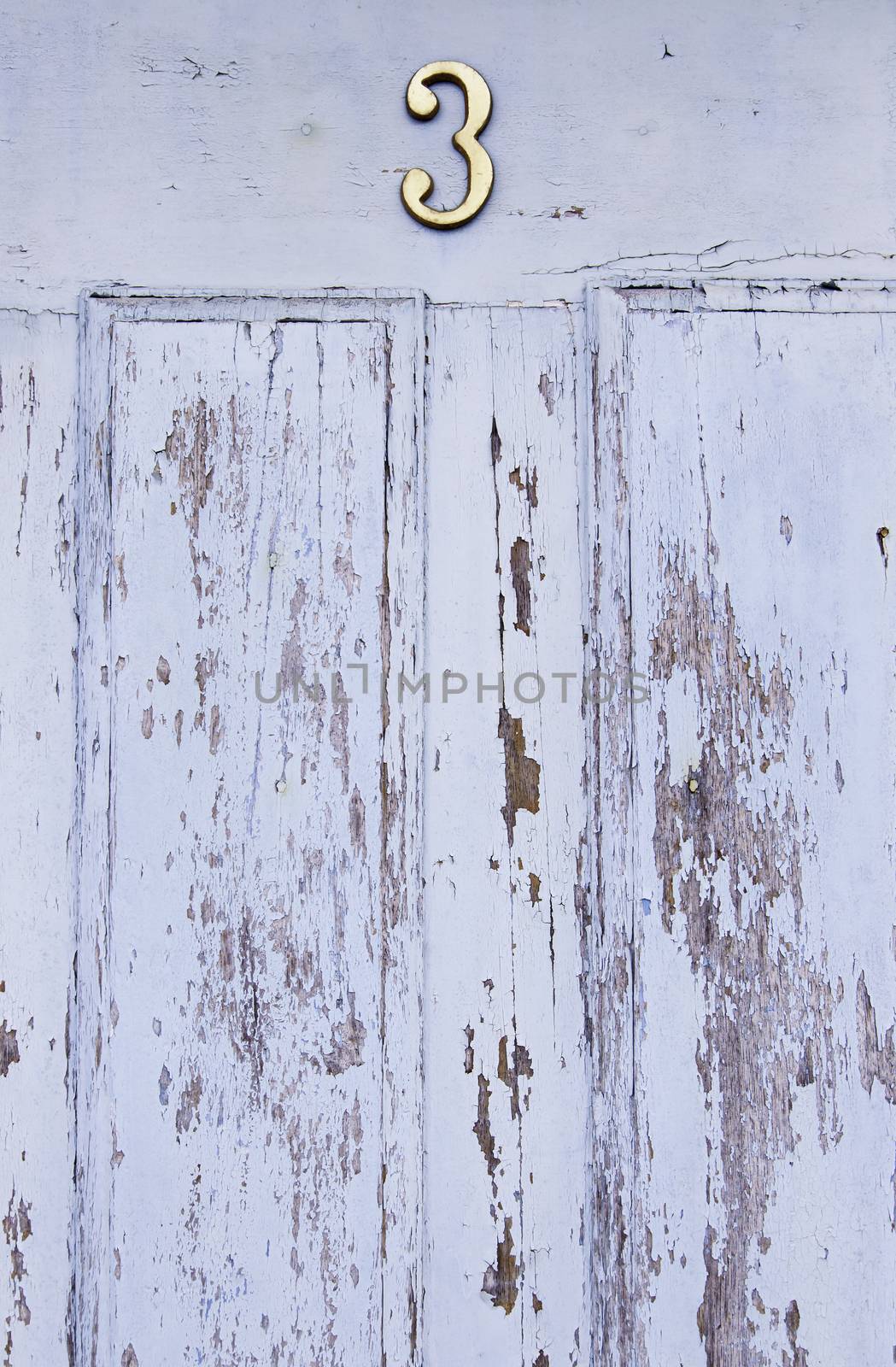 Old decorated door in blue, detail of urban decoration, protection
