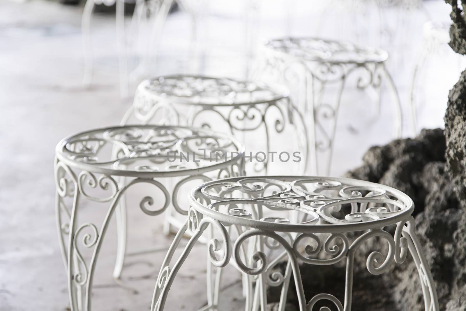 Terrace of a bar on the street, detail of a few tables and chairs