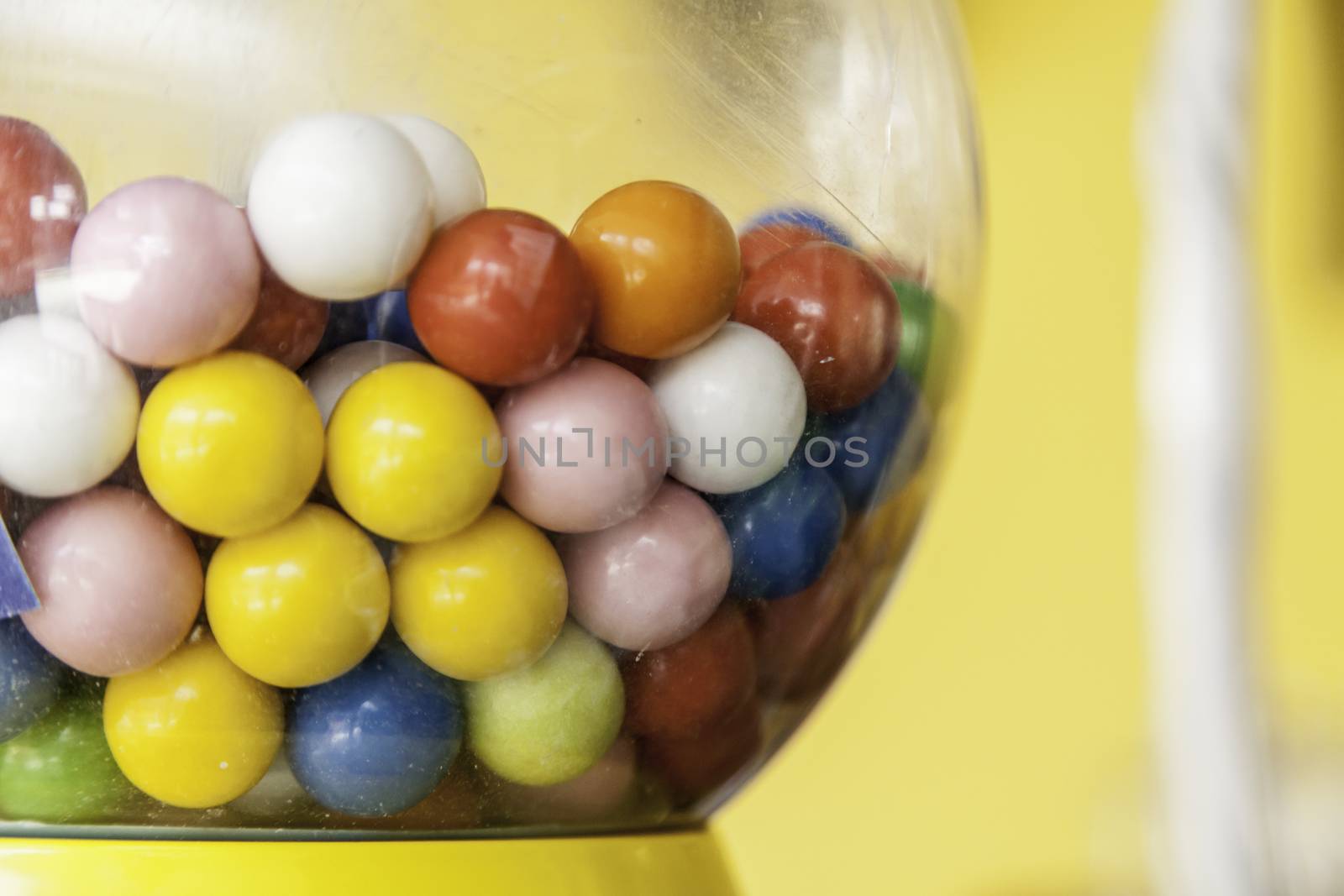 Gumballs in a machine by esebene