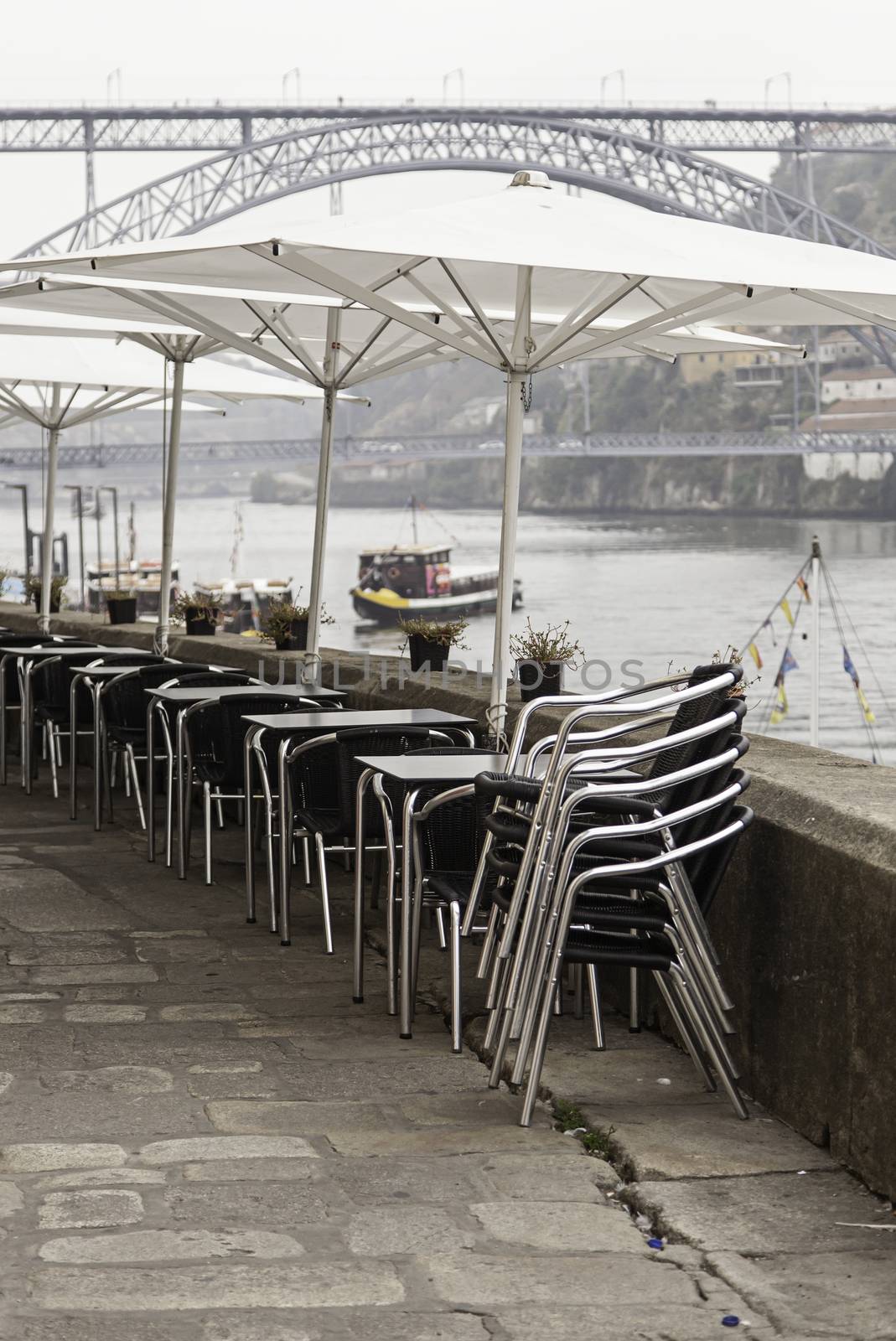 Terrace of a bar on the street, detail of a few tables and chairs