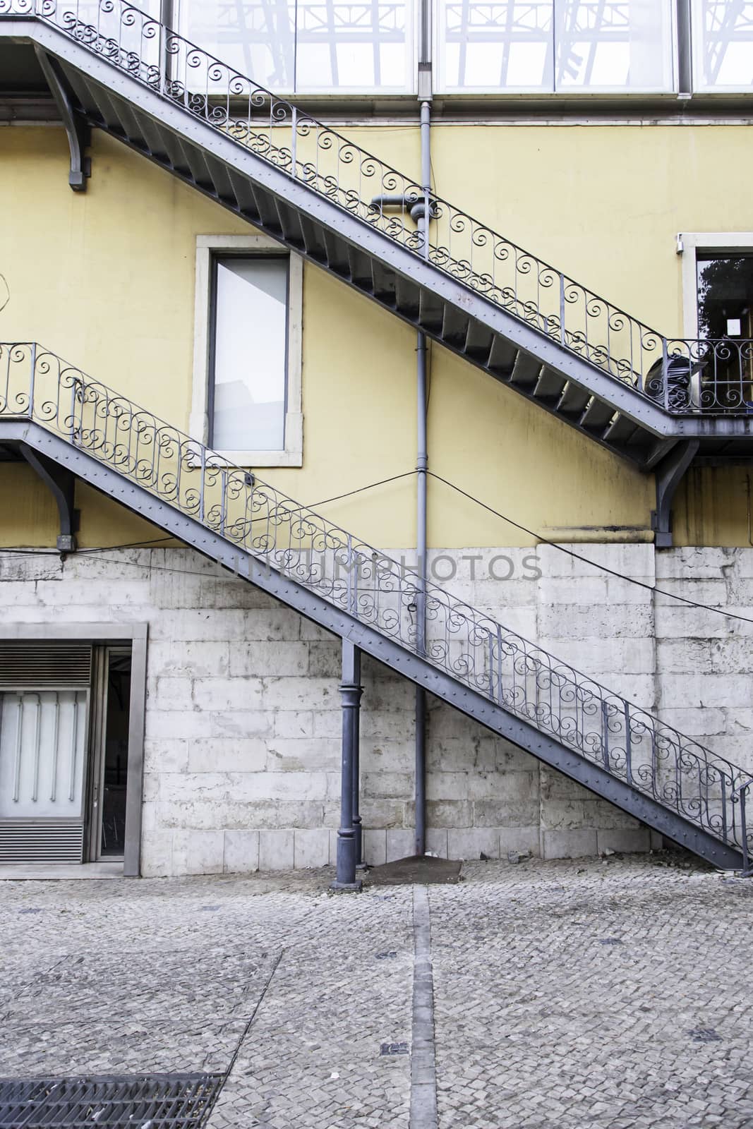 Black stone staircase, detail of a staircase, pedestrians