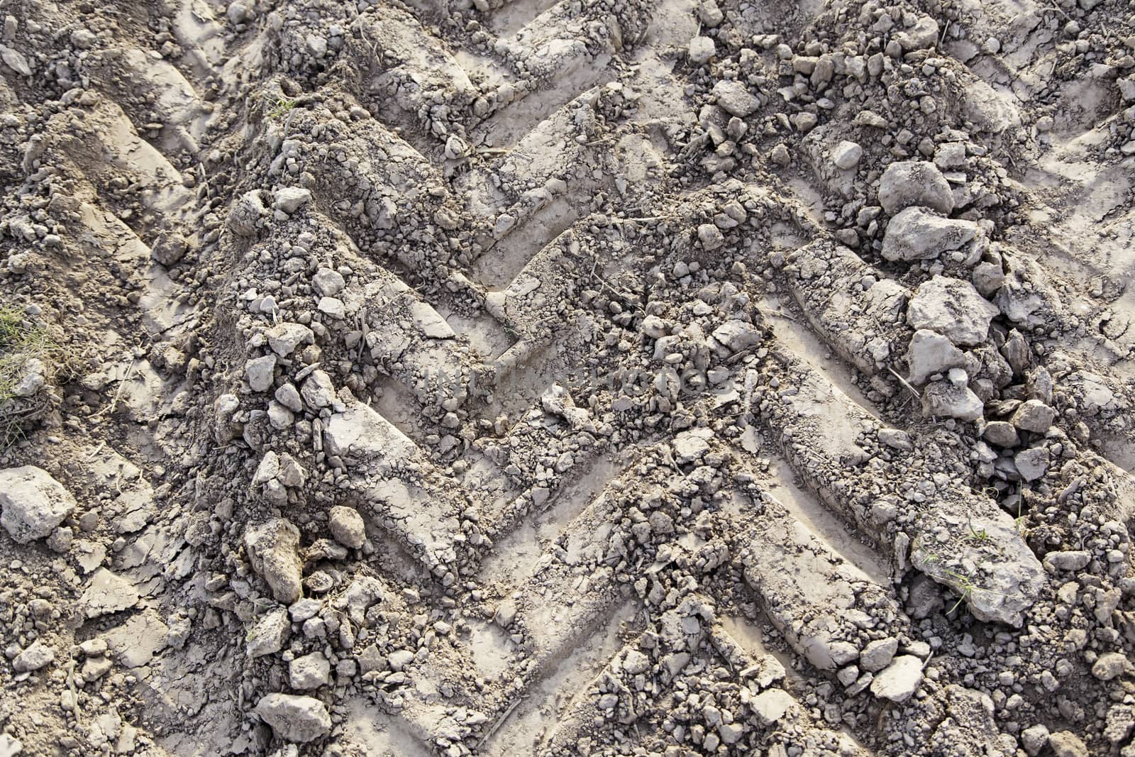 Traces of wheels in the mud, detail of marks in the nature