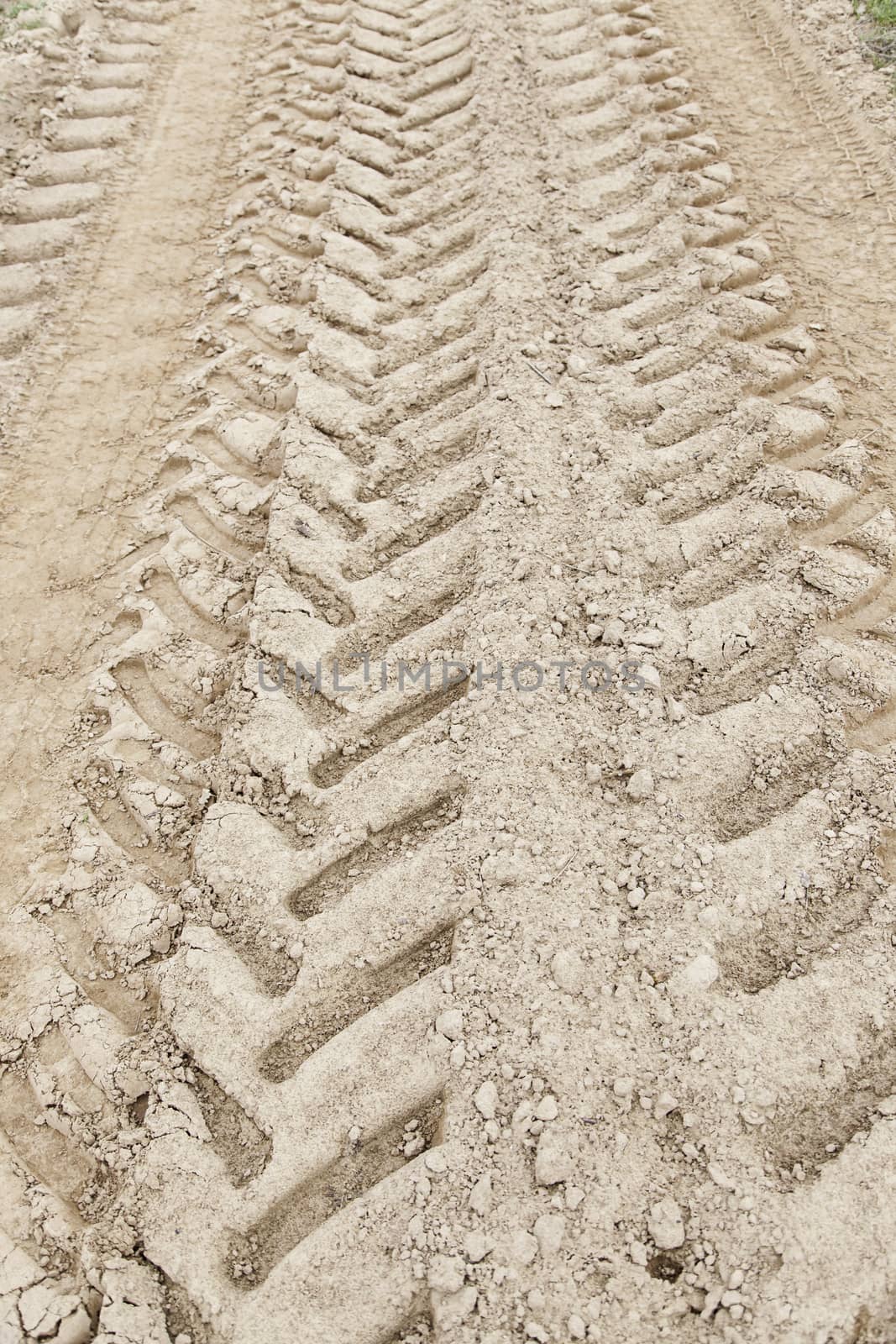 Traces of wheels in the mud, detail of marks in the nature