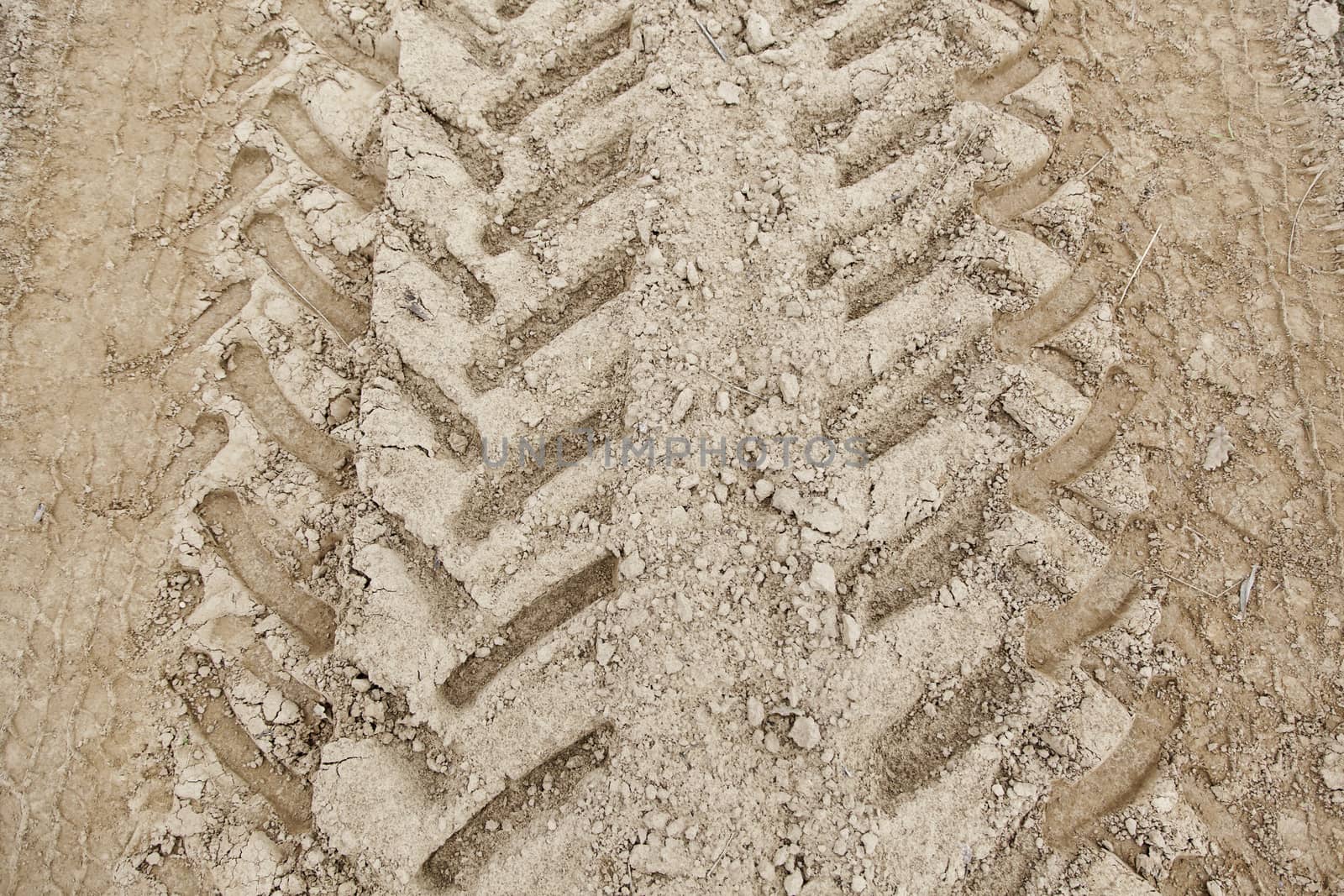 Traces of wheels in the mud, detail of marks in the nature