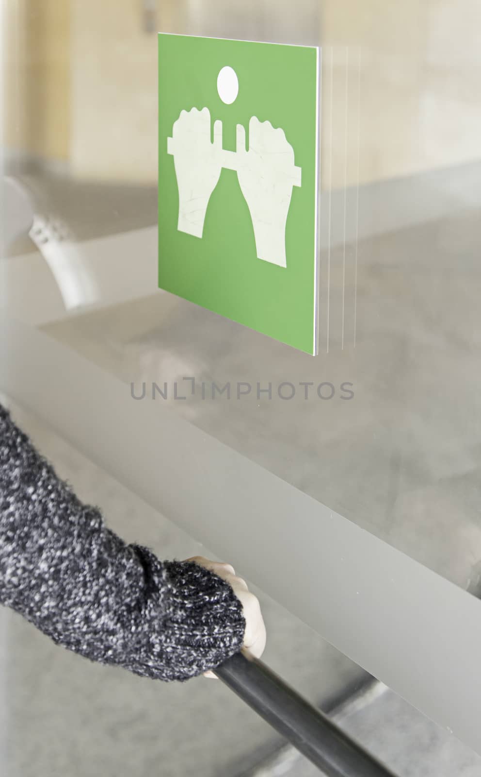 Opening a door, detail of a woman opening a door, access