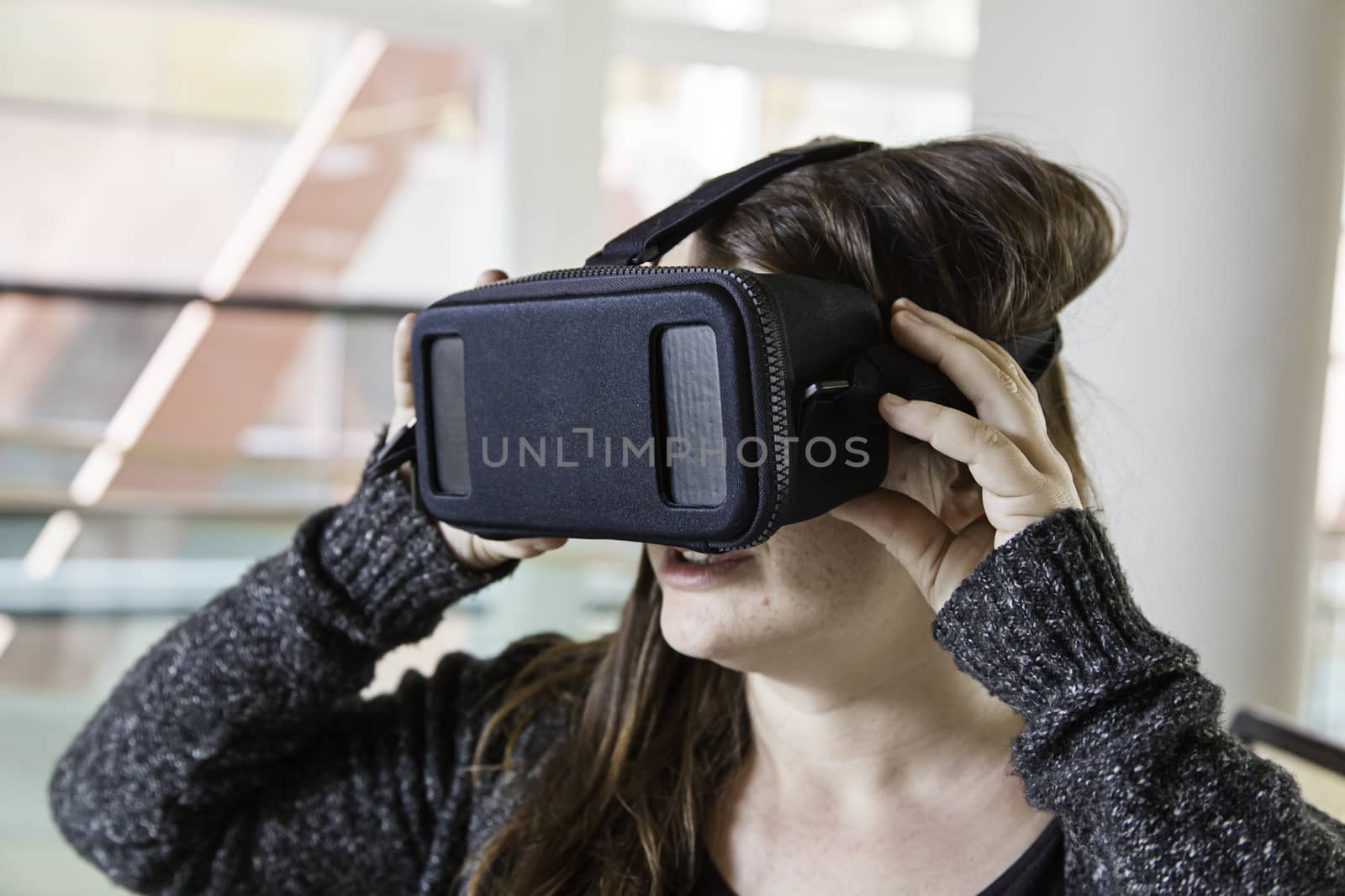 Woman with virtual reality glasses playing, technology and entertainment