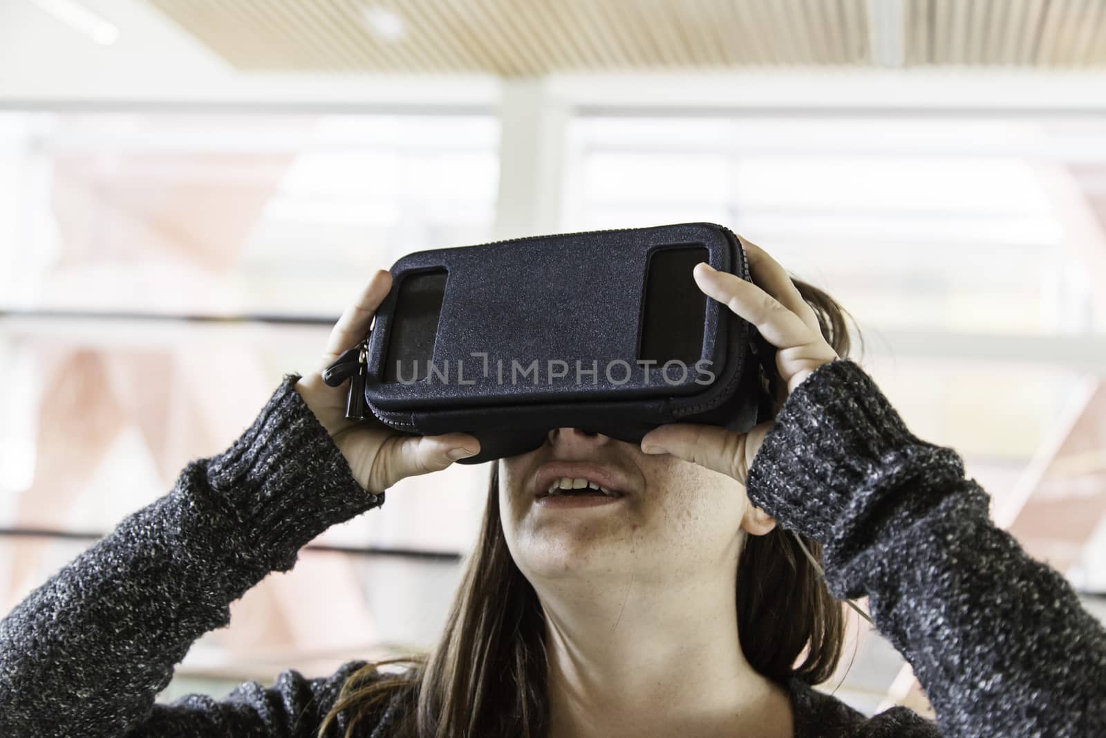 Woman with virtual reality glasses playing, technology and entertainment