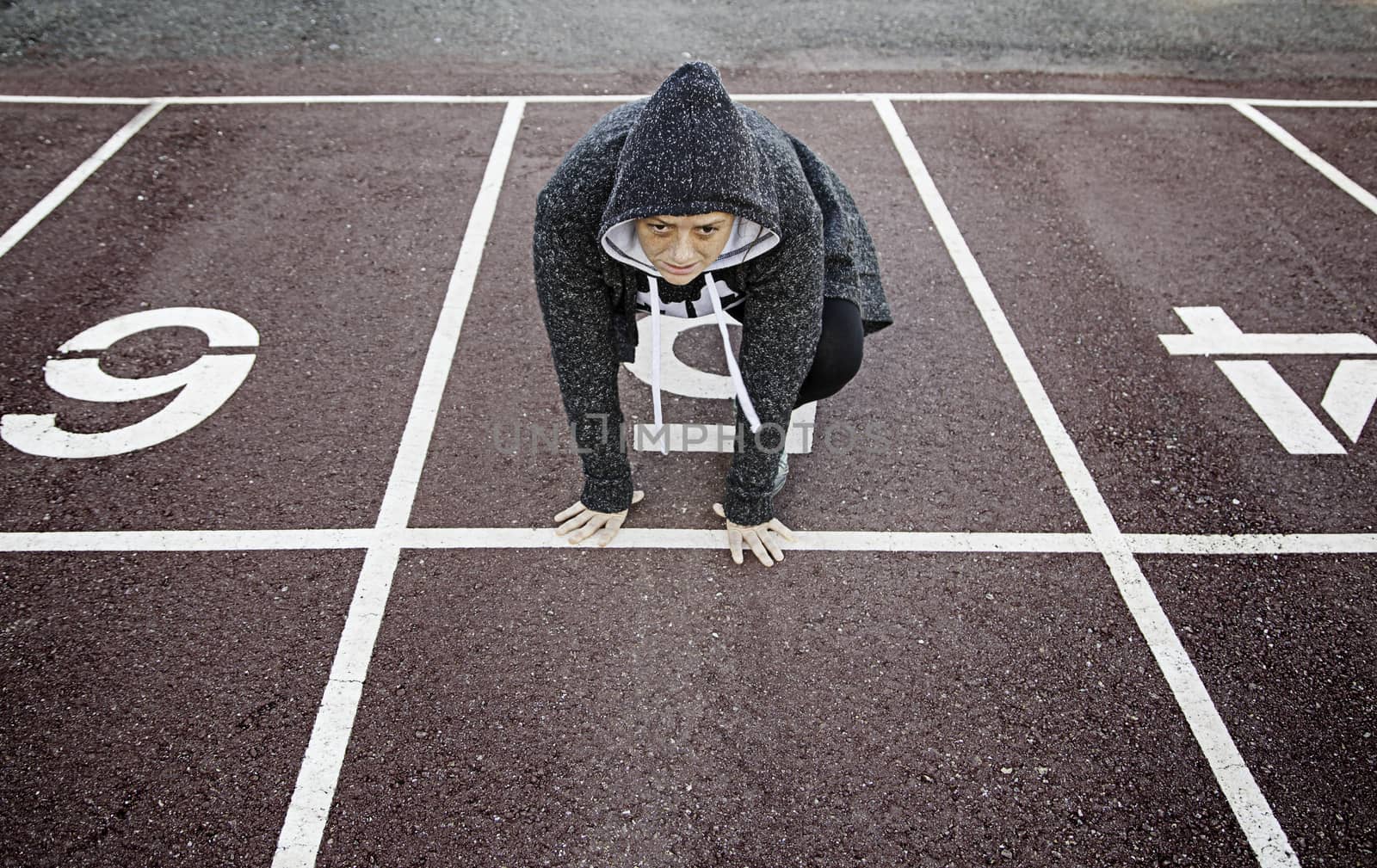 Woman on athletics track, sport and training, excercise