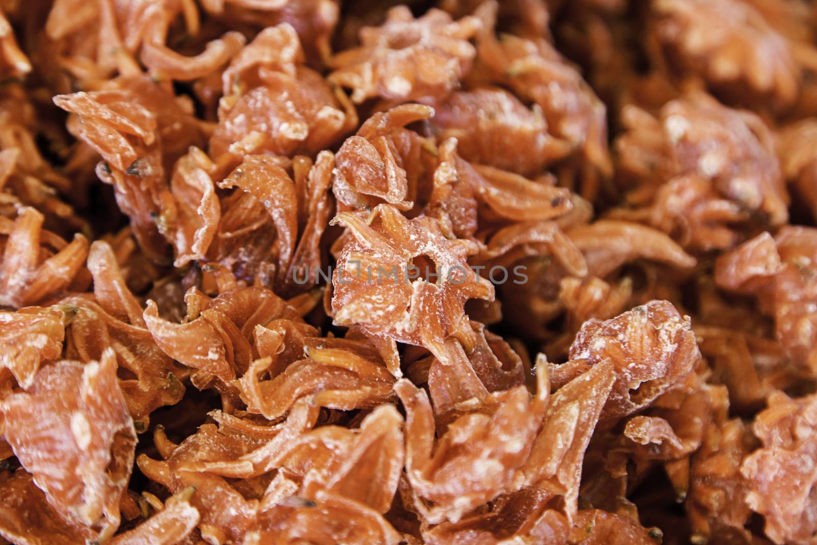 Dry edible hibiscus flower, caramelized flower detail, healthy food