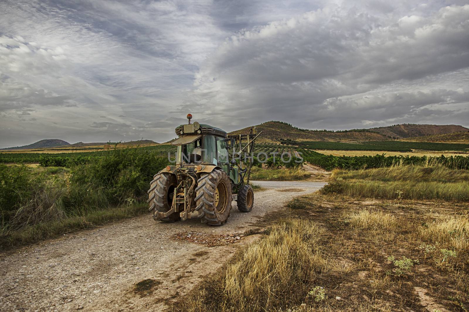 Tractor, field, detail of agricultural machinery, work in the field