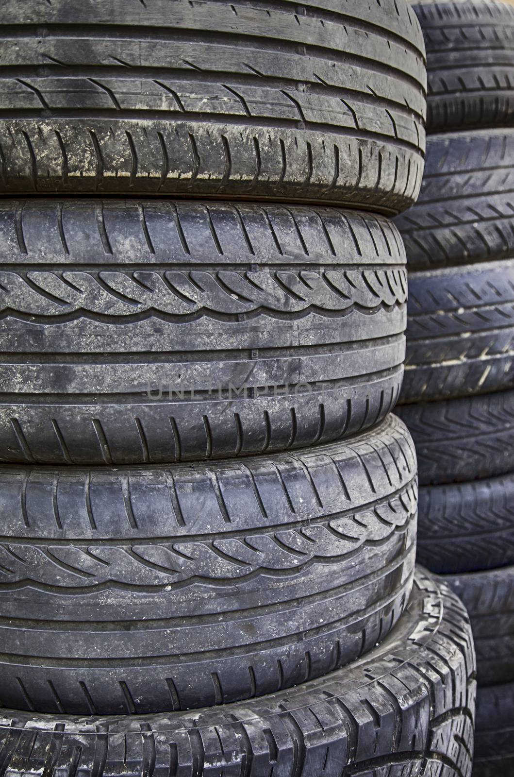 Old tires, detail of old car wheels, rubber, pollution
