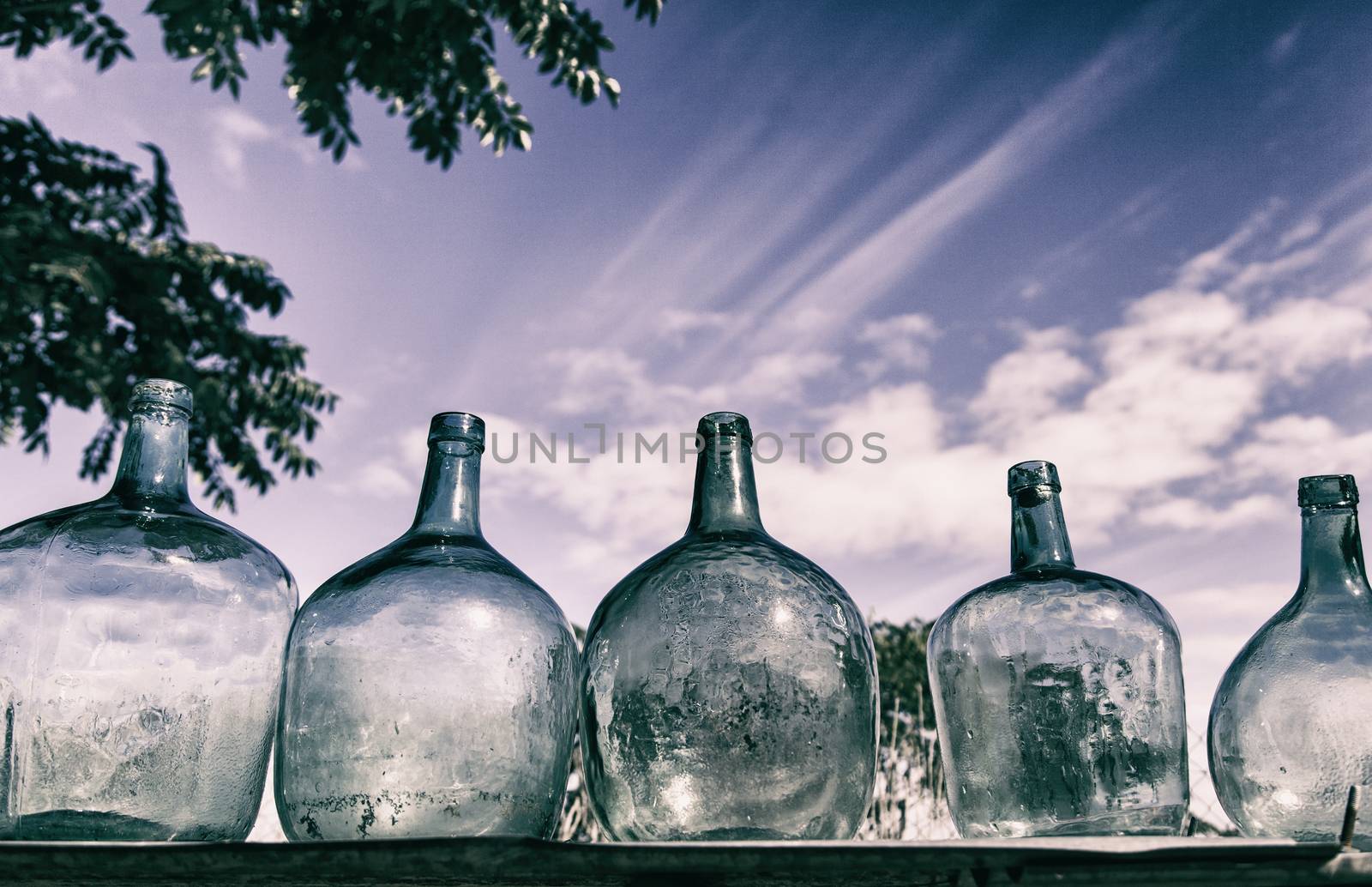 Old glass bottles, detail of some containers to save liquid
