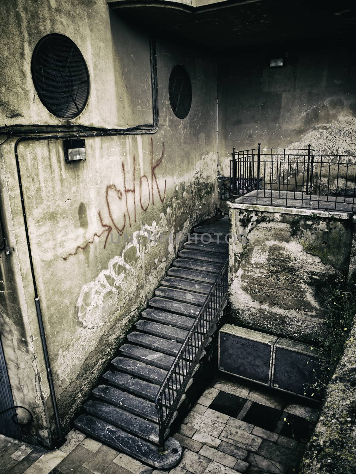 Old stone stairs, detail of a pedestrian stairs in the city, dirt and neglect