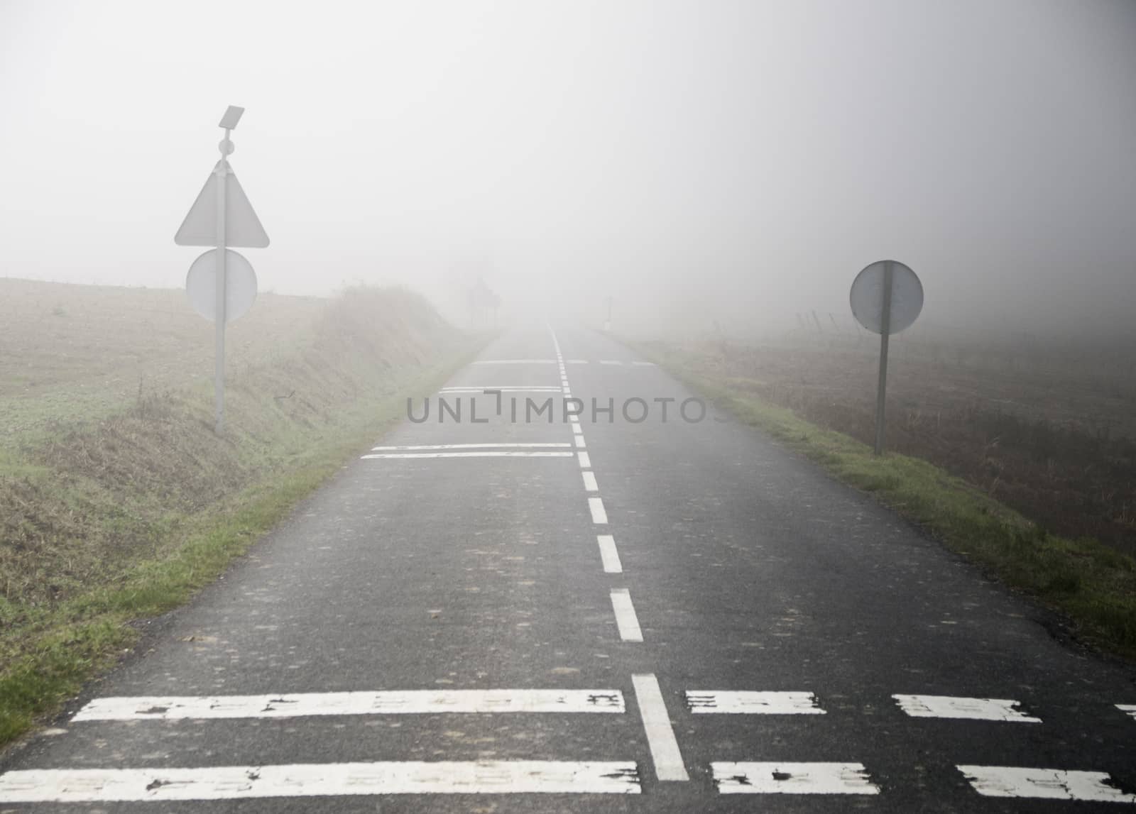 Fog, road, detail of a road without visibility, atmospheric phenomenon
