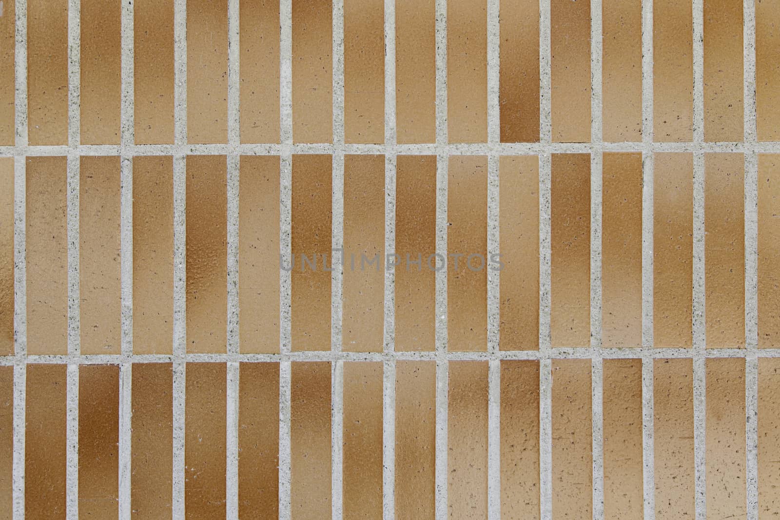 Wall decorated with bricks, detail of a facade, decoration and architecture