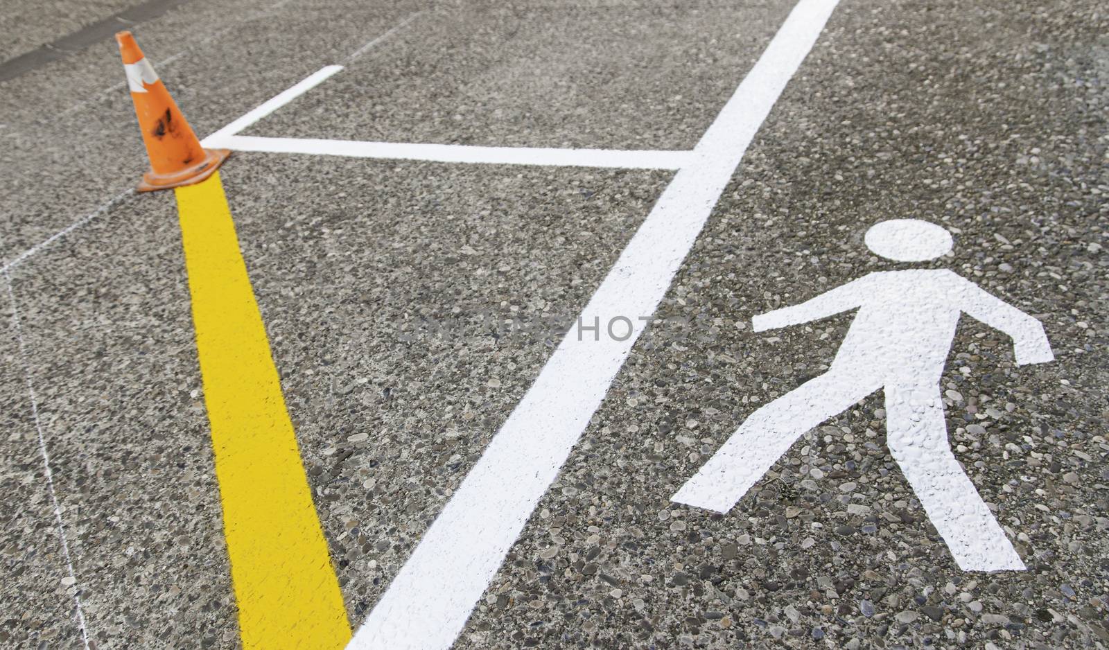 Pedestrian on the asphalt, detail of an area for pedestrian use, information and security
