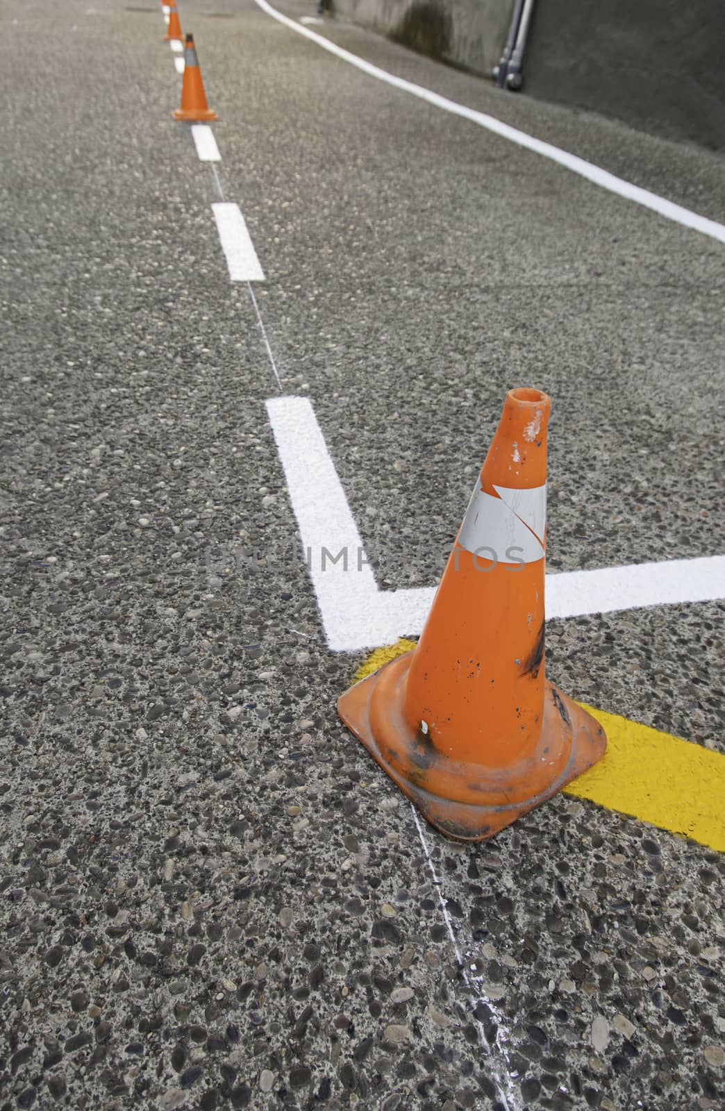 Cone of signaling in the asphalt, detail of works and improvements in the highway
