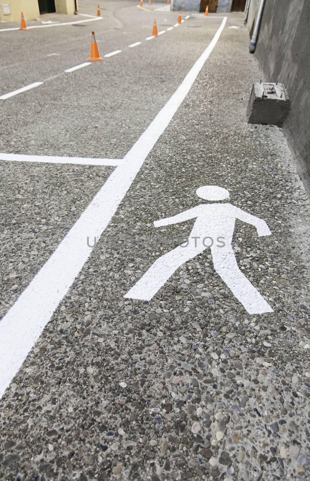 Pedestrian on the asphalt, detail of an area for pedestrian use, information and security