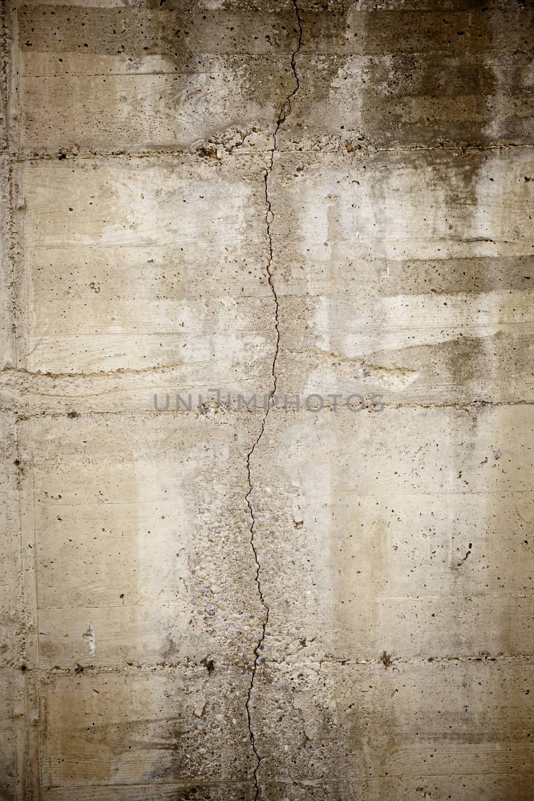 Cracked concrete wall, detail of abandoned background, ruin and insecurity