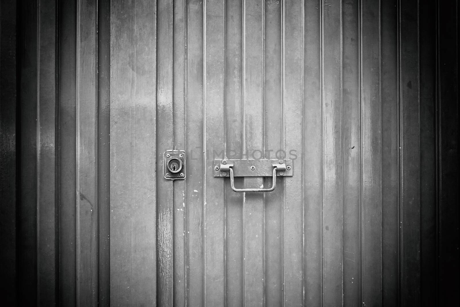 Blue metal door, detail of a closed door painted blue