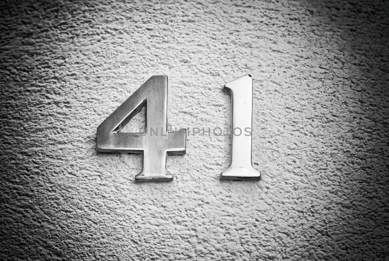 Number forty-one on the wall of a house, detail of an odd number