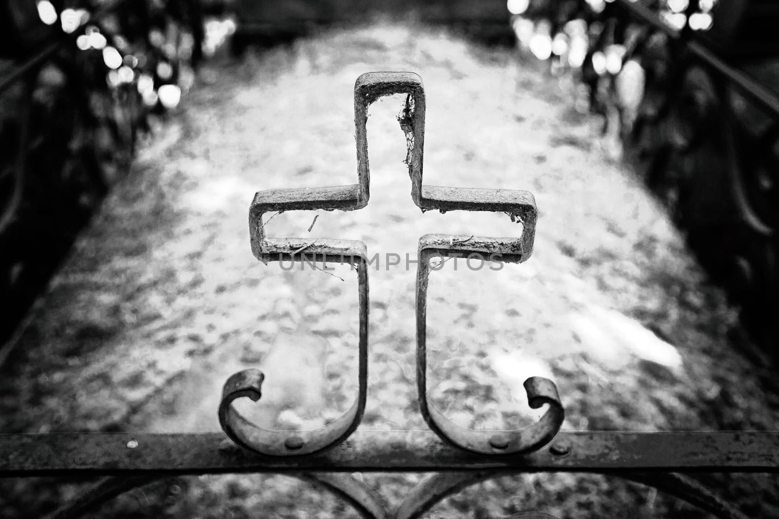 Religious cross on a grave, detail of an old cross in a cemetery