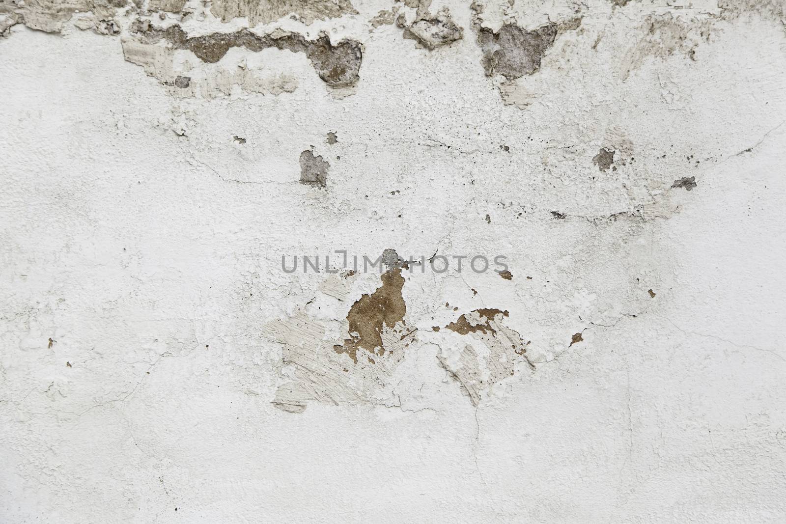 Concrete wall with moisture, detail of erosion and ruin, textured background
