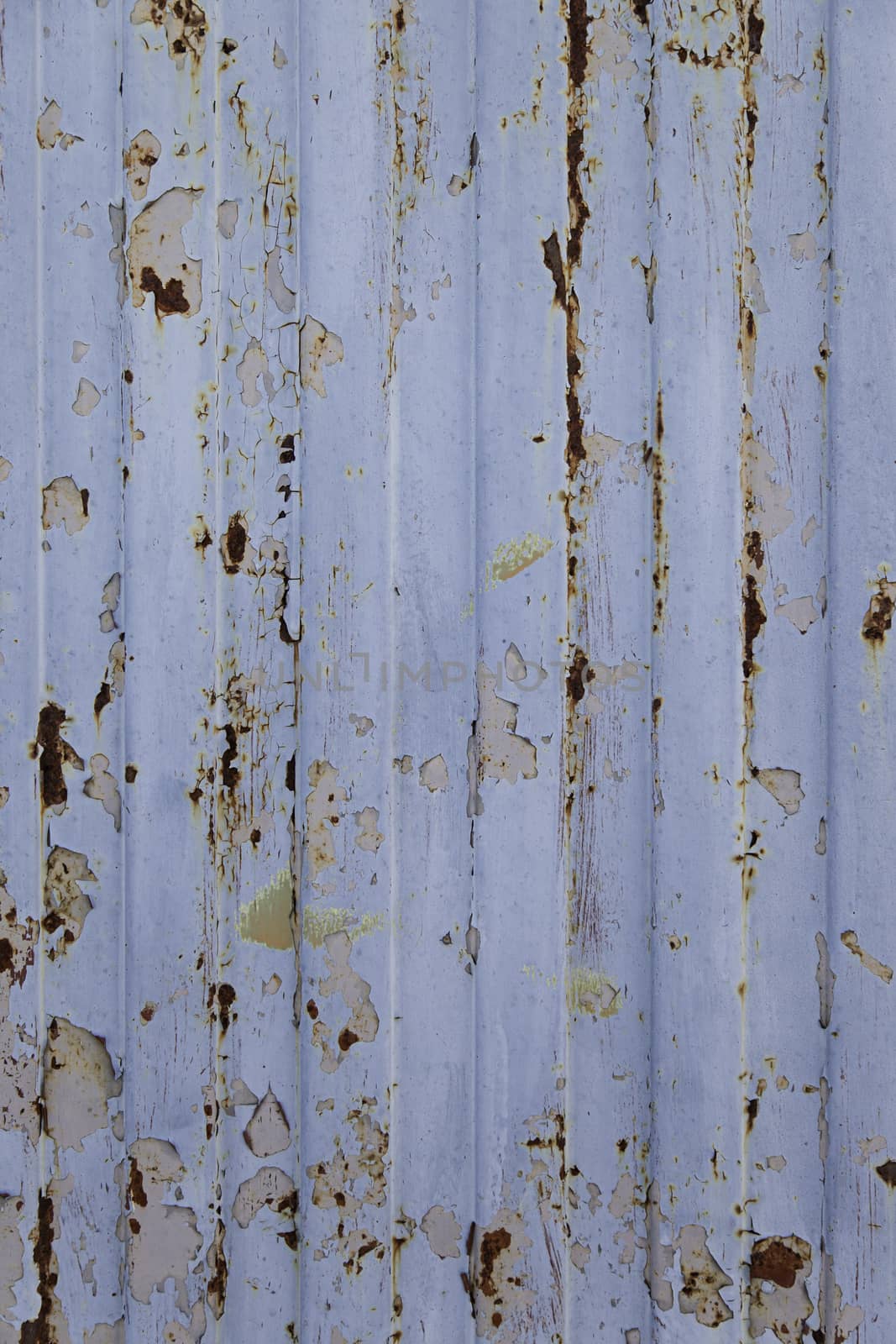 Spoiled metal wall, detail of a rusty metal, textured background