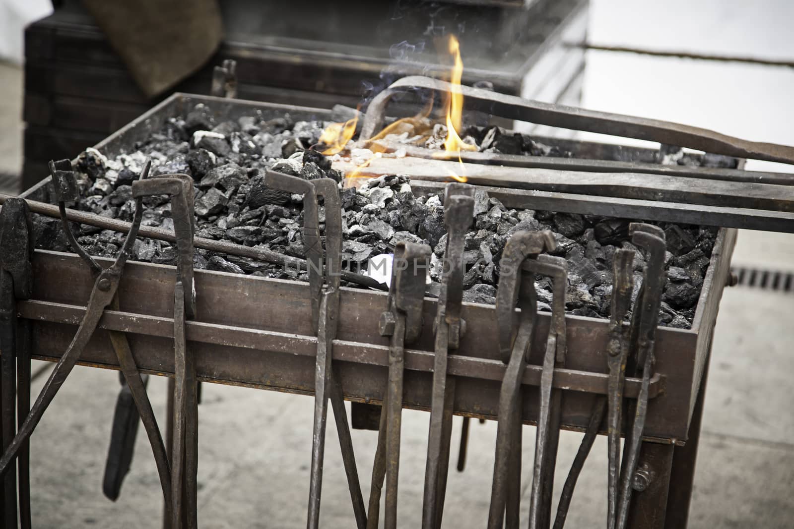 Embers in a forge, detail of an old iron forge, molding iron