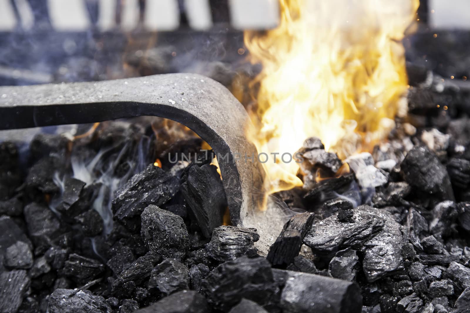 Embers in a forge, detail of an old iron forge, molding iron