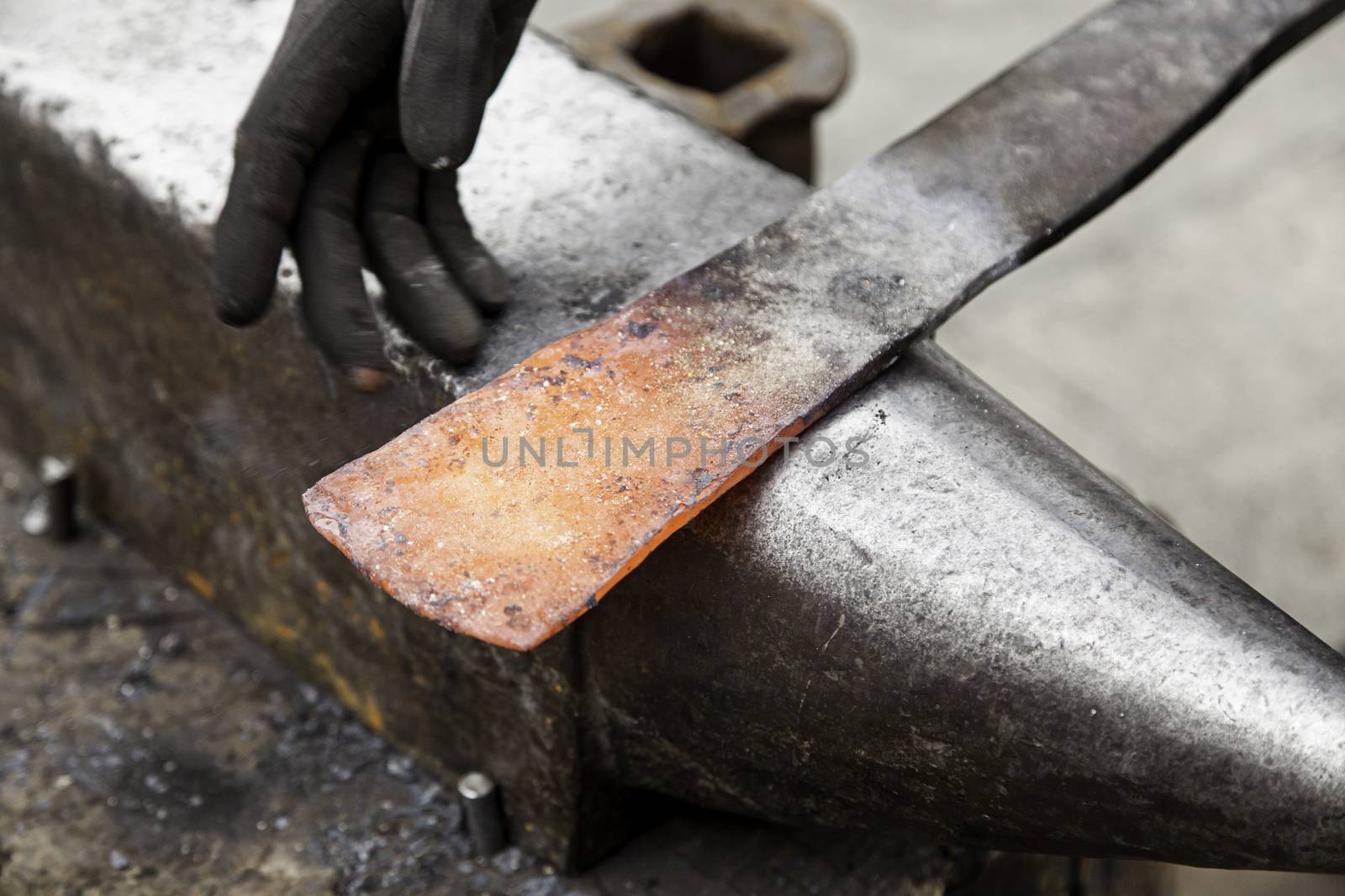 Red hot iron in a forge, working with hot iron, traditional work