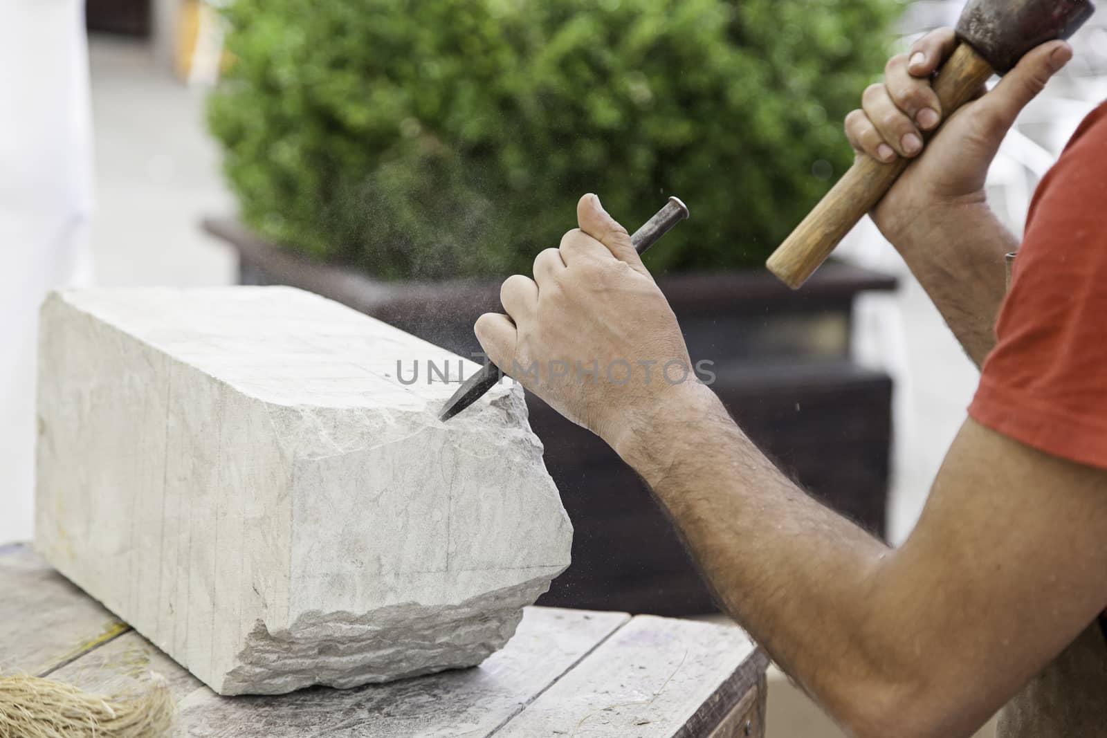 Carving stone, craftsman shaping stone, art and crafts
