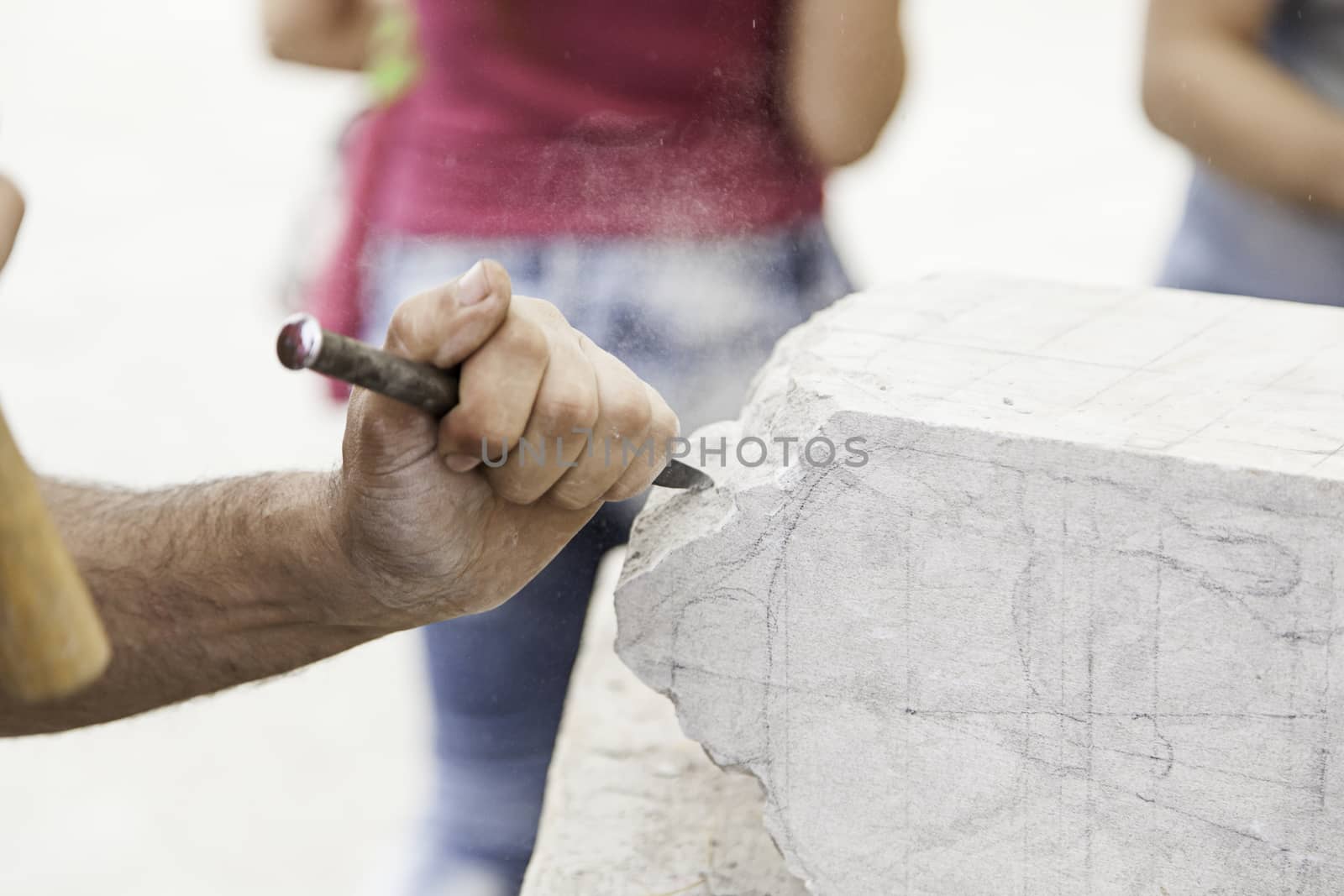 Carving stone, craftsman shaping stone, art and crafts