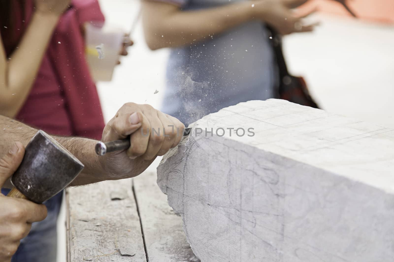 Carving stone, craftsman shaping stone, art and crafts