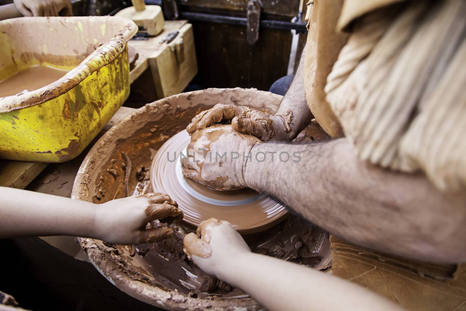 Person working with clay, detail of craftsmanship, craftsmanship in clay, potter