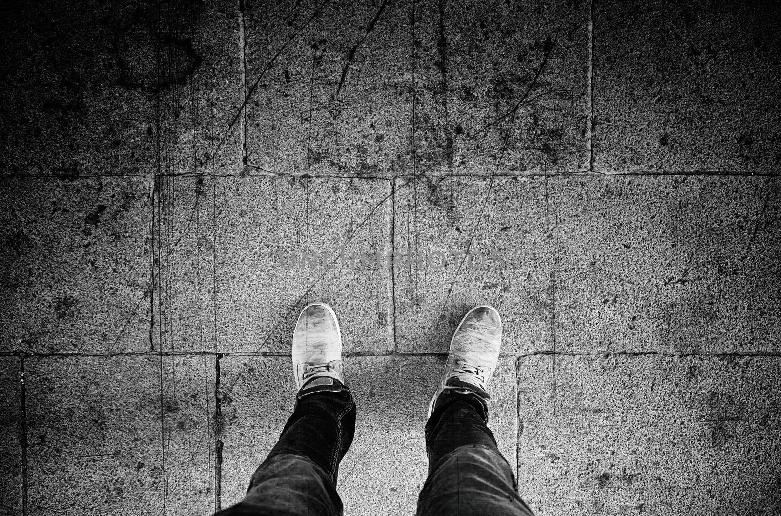 Feet floor, detail of walking boots
