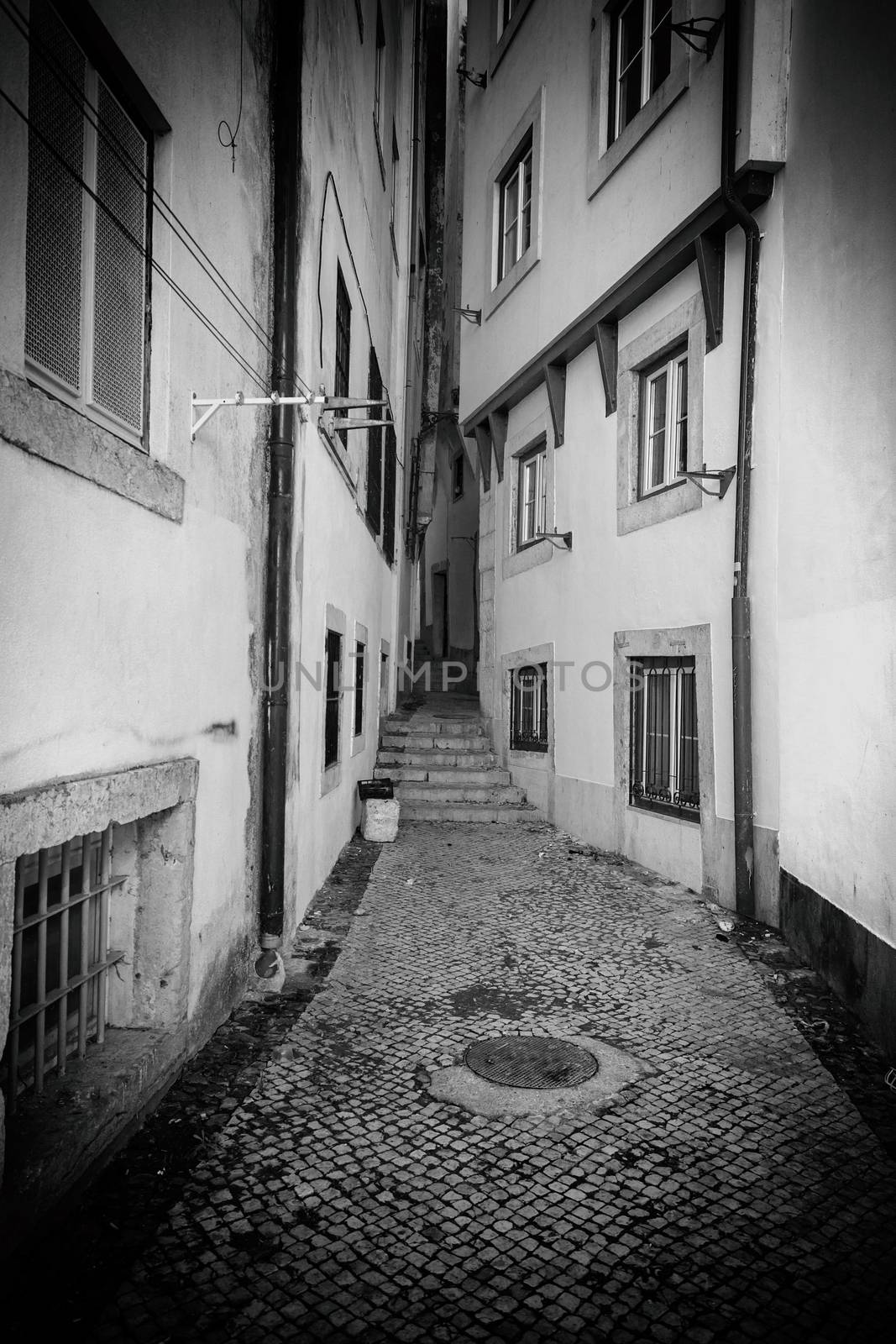 Old alley in the city, detail of an old city, promenade and tourism