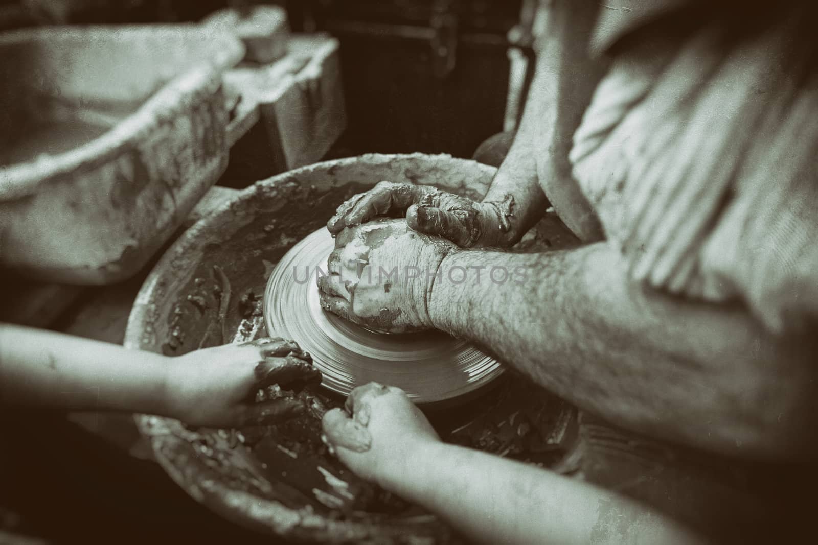 Person working with clay, detail of craftsmanship, craftsmanship in clay, potter
