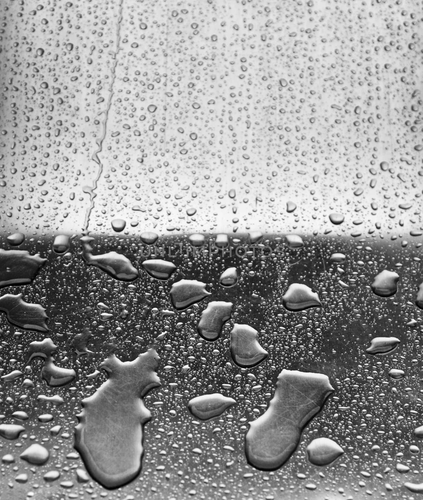 Water drops in metal, detail of rain water, water background, winter