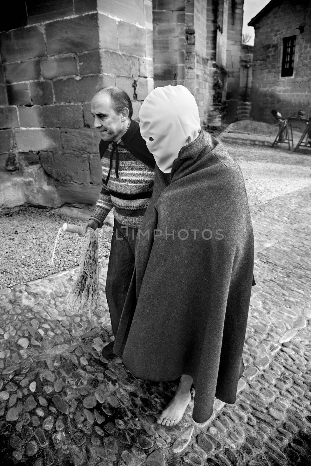 SAN VICENTE DE LA SONSIERRA, SPAIN - GOOD FRIDAY FRIDAY APRIL 6: Man does penance through self-flagellation during Easter holy procession on April 6, 2012, San Vicente de la Sonsierra, Spain.