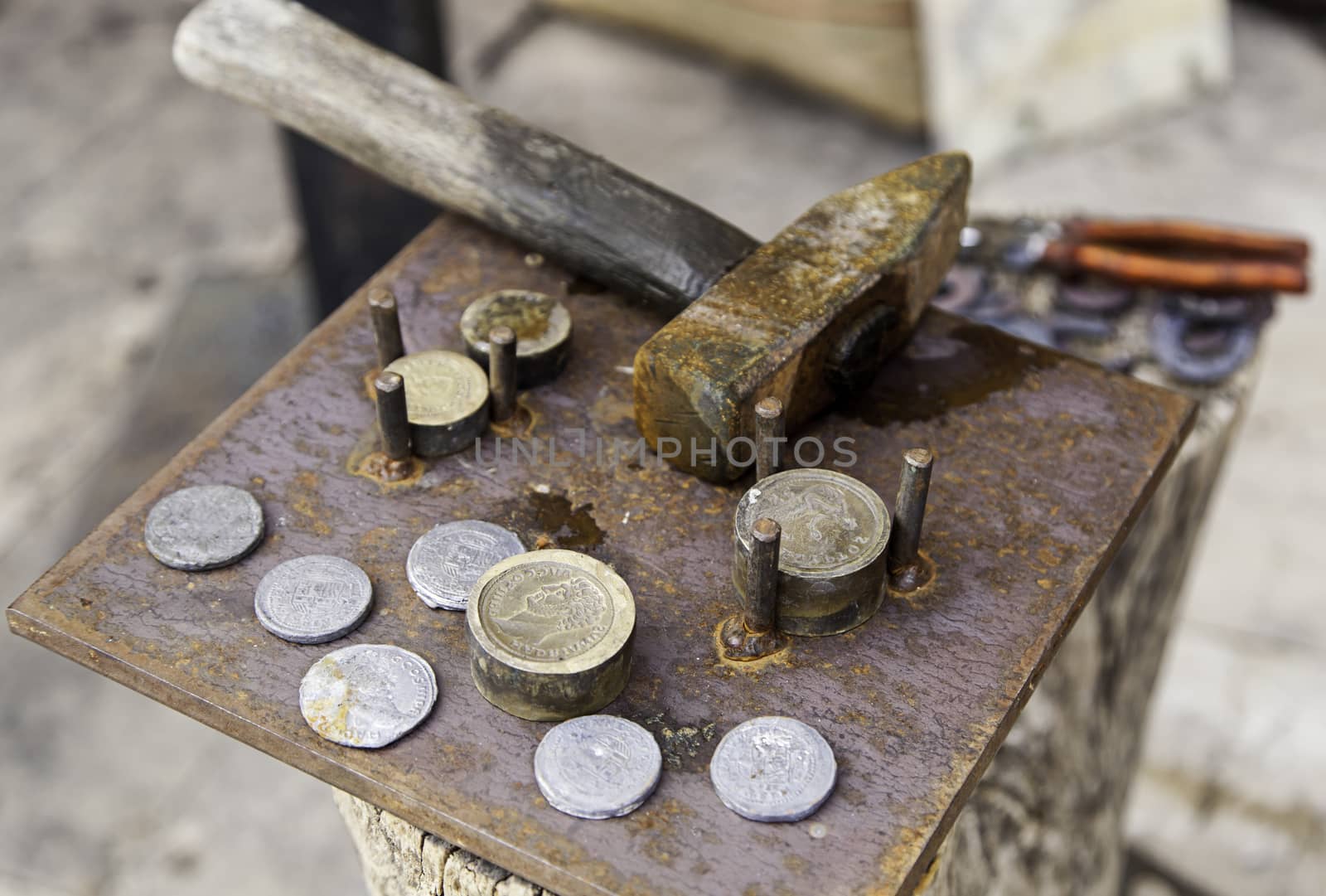 Making handmade coins, handicraft work detail, antiquity
