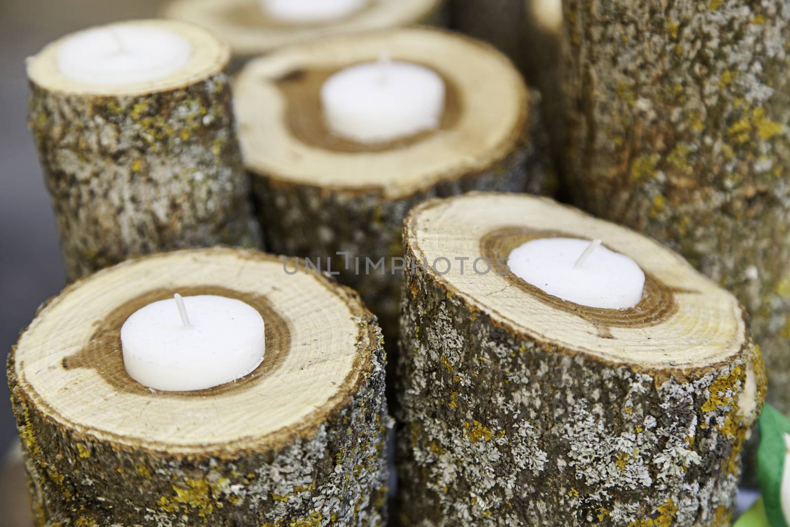 Candles with wood, detail of some candles in a spa, zen relaxation