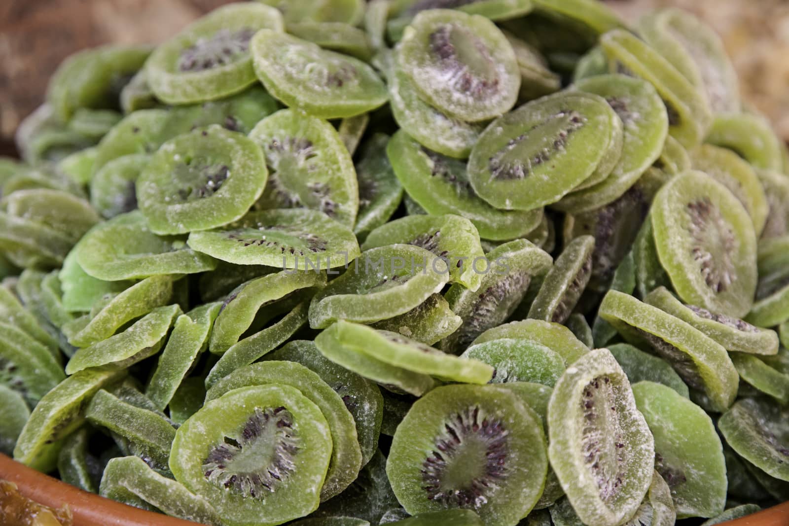 Dried kiwi, detail of dried fruit with sugar, food preservation, healthy food
