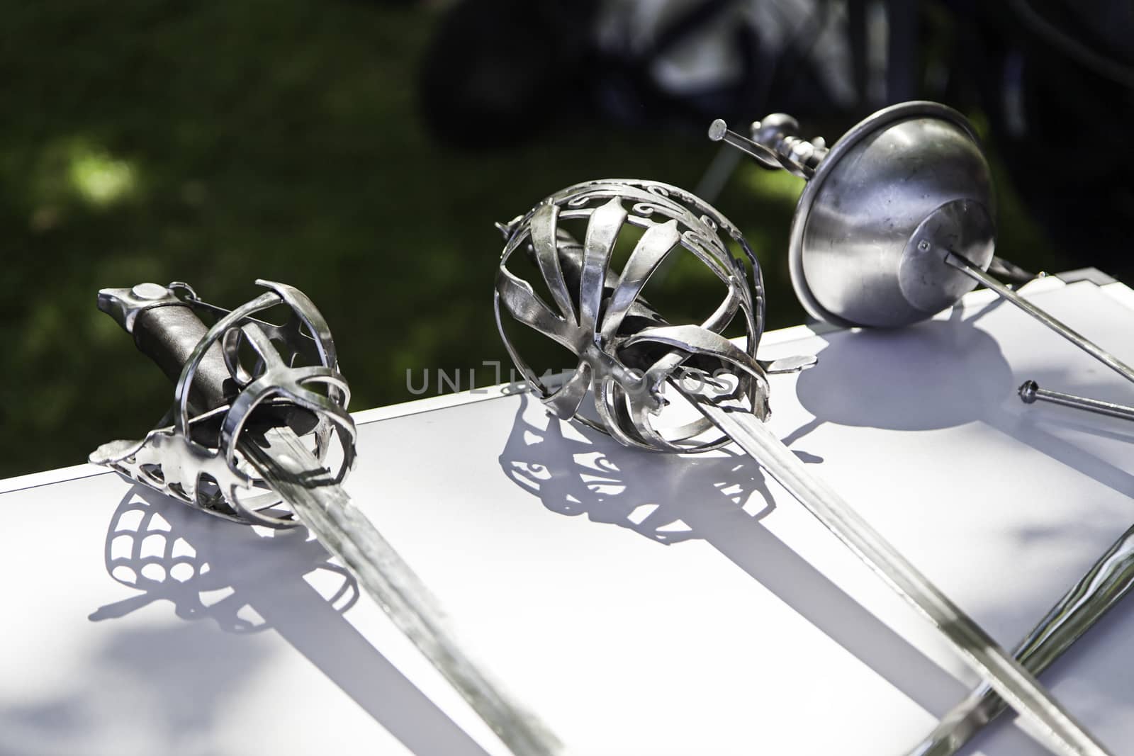 Old medieval swords, detail of old weapon of war, history and death, white weapon