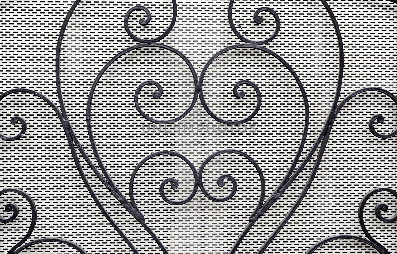 Forge with curves, detail of a decoration with metal
